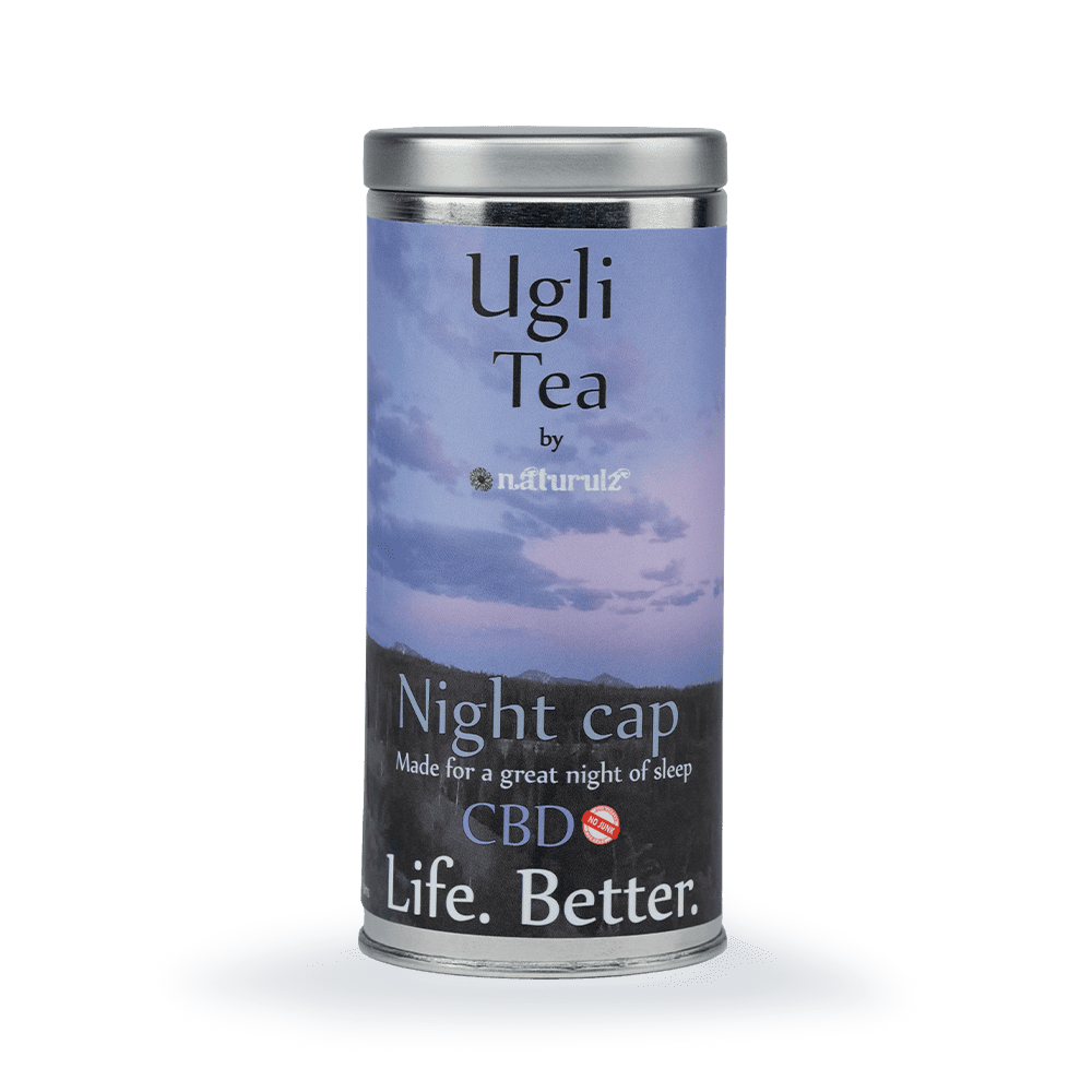 A can of tea that is sitting on the ground.